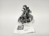 Assembled unpainted gray plastic Warhammer 40,000 Necron Annihilation Barge miniature with twin cannon barrels, skeletal robotic figures and curved wing plates, shown on a white background above a label card reading "HFG-22" and "Annihilation Barge" alongside a QR code.