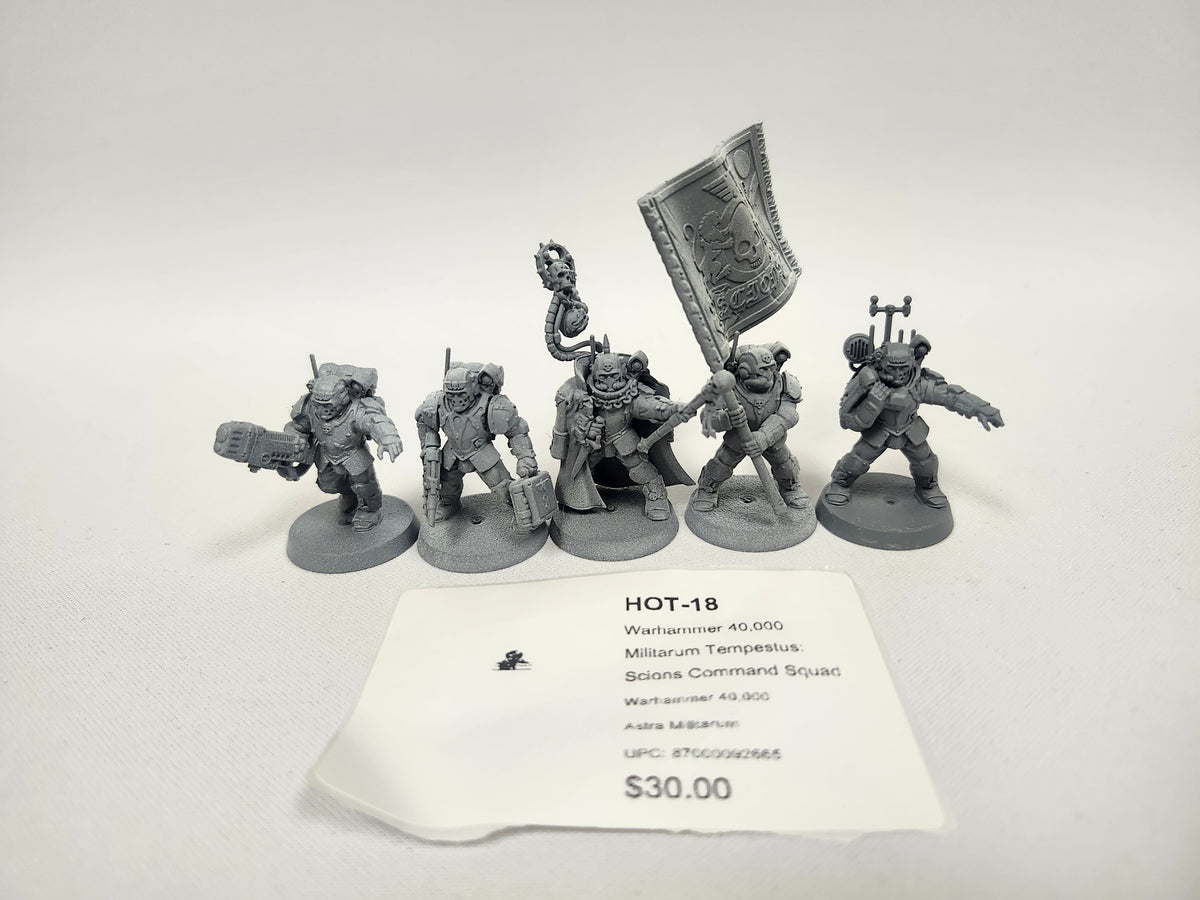 Five unpainted gray Warhammer 40,000 miniature soldiers on round bases, one carrying a large engraved banner and another holding a staff topped with a skull, posed in a row. A white label in front reads "HOT-18" and "Militarum Tempestus: Scions Command Squad".
