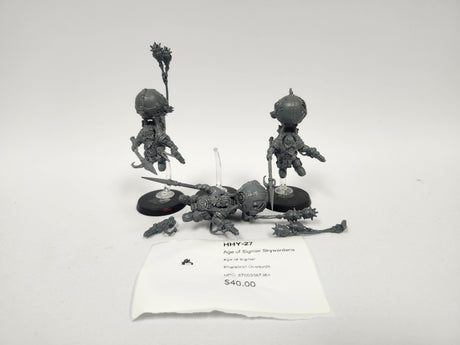 Three unpainted grey plastic Age of Sigmar Skywardens miniatures on a white surface: two figures on clear flying stands with black oval bases holding weapons and a banner, and one figure lying on its side with a spear and detached mace. A label reads "HHY-27" and "Age of Sigmar Skywardens".