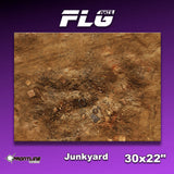 Rectangular Junkyard gaming mat shown from above, printed with a mottled rusty-brown scrapyard scene scattered with debris and tire tracks. The purple graphic is labeled “Junkyard” and “30x22"” beneath a large “FLG” logo.