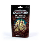 A black and dark red Warhammer Underworlds card pack stands upright, illustrated with a pale fortress staircase tangled in thorny branches. The packaging reads “Warhammer Underworlds,” “Fearsome Fortress” and “Rivals Deck.”
