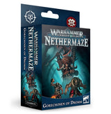 A dark blue Warhammer Underworlds game expansion box shows three armored fantasy warriors against a teal background. The front reads “Warhammer Underworlds: Nethermaze” and “Gorechosen of Dromm”; the left spine repeats the title, with an “Expansion” label near the bottom.