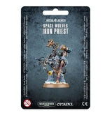 Front of a dark mottled package displaying a blue-gray armored Space Wolves miniature with gold and copper details, a raised hammer-like tool, a gun and a round tan base. The package reads “SPACE WOLVES IRON PRIEST” and “CITADEL.”
