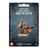 Front of a dark blue-gray blister card displaying the Ulrik the Slayer miniature in black and gold armor, with a red windswept cloak, skull details, and a red staff on a round base. The card reads “SPACE WOLVES” and “ULRIK THE SLAYER.”