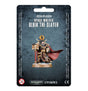 Front of a dark blue-gray blister card displaying the Ulrik the Slayer miniature in black and gold armor, with a red windswept cloak, skull details, and a red staff on a round base. The card reads “SPACE WOLVES” and “ULRIK THE SLAYER.”