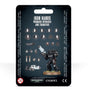 Front of a black-backed Iron Hands Primaris upgrade set, with a black-armored miniature holding a pale blue gun and rows of shoulder pads, heads, weapons and small accessories. The card reads “IRON HANDS” and “PRIMARIS UPGRADES AND TRANSFERS.”