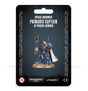 A blue-armored Space Marines captain miniature with a raised rifle, white cape and tan round base is shown on a black backing card. The card reads “SPACE MARINES PRIMARIS CAPTAIN IN PHOBOS ARMOUR” above the figure, with Warhammer 40,000 and Citadel logos below.