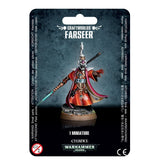 A packaged Aeldari Farseer miniature stands on a round base, wearing red-orange robes, a purple-trimmed cape and an ornate helmet, with a teal spear and one arm extended. The card reads “CRAFTWORLDS FARSEER” and “1 MINIATURE.”