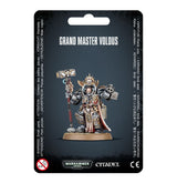 Front of a black-backed package displaying an armored Grey Knights miniature in silver and gray with gold details and red accents, holding a hammer and a large weapon. The card reads “GRAND MASTER VOLDUS” above the figure, with “WARHAMMER 40,000” and “CITADEL” logos below.