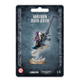Front of a dark blue-gray Harlequin Death Jester miniature package, showing a masked figure in black, purple and teal clothing holding a long gun above a decorated base. The card reads “HARLEQUIN DEATH JESTER” and “1 MINIATURE.”