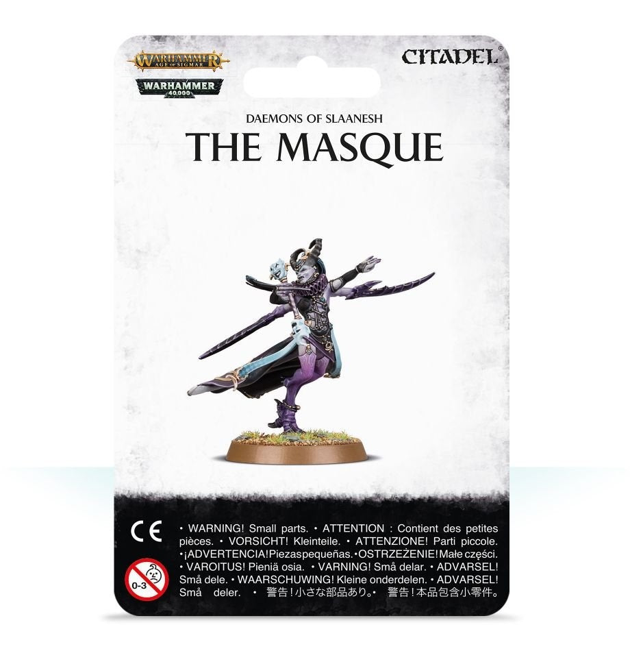 Front of a white Games Workshop package labeled “THE MASQUE” and “DAEMONS OF SLAANESH,” with a painted purple, black and pale-blue miniature posed dynamically on a round grassy base.