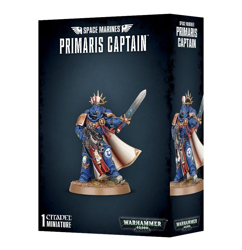 Black Space Marines: Primaris Captain miniature box showing a blue-armored figure with gold trim, a raised sword, rifle, red details and a flowing white cloak; a second view appears on the side panel. The front reads “PRIMARIS CAPTAIN” and “1 CITADEL MINIATURE.”