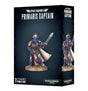 Black Space Marines: Primaris Captain miniature box showing a blue-armored figure with gold trim, a raised sword, rifle, red details and a flowing white cloak; a second view appears on the side panel. The front reads “PRIMARIS CAPTAIN” and “1 CITADEL MINIATURE.”