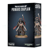 Black Primaris Chaplain miniature box shown from the front and right side, with artwork of a skull-helmeted figure in dark armor, holding red weapons on a round base. The front reads “SPACE MARINES” and “PRIMARIS CHAPLAIN.”