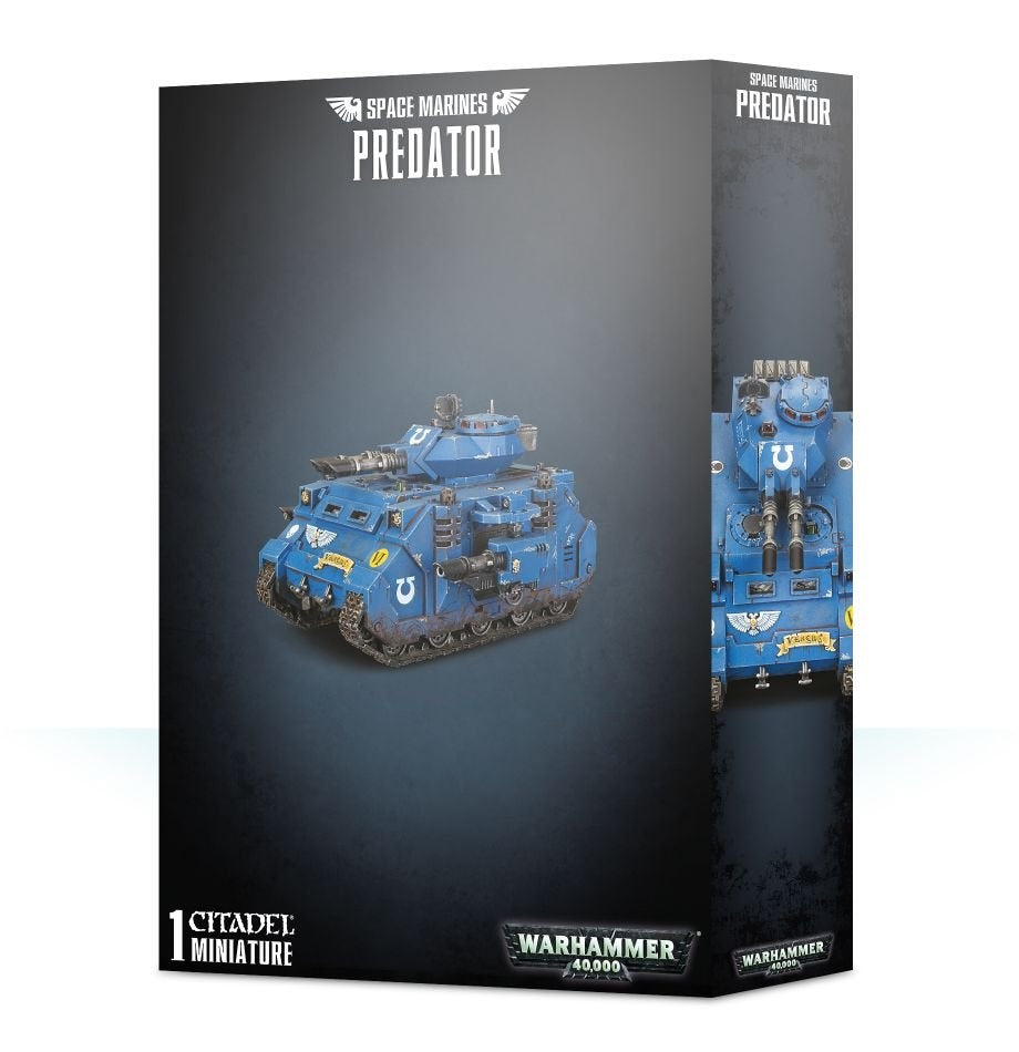A dark gray box for a Space Marines Predator miniature shows a blue tracked tank with a turret and mounted guns on the front, plus a close front view on the side panel. The box reads “SPACE MARINES” and “PREDATOR.”