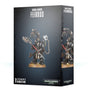Dark gray Iron Father Feirros miniature box shown from the front and right side, with matching artwork of an armored figure holding a red-handled weapon and mechanical arms above a round base. The front reads “IRON HANDS FEIRROS” and “1 CITADEL MINIATURE.”