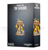 Black box showing a yellow-armored Tor Garadon miniature with red shoulder cloth, standing on a round base among gray rubble; the front and right side repeat the figure. Text reads “IMPERIAL FISTS,” “TOR GARADON,” and “WARHAMMER 40,000.”