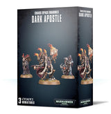 Dark gray box shown from the front and right side, illustrated with three armored, hooded miniatures on round bases, including a central figure holding a flaming book. Front text reads “CHAOS SPACE MARINES,” “DARK APOSTLE” and “3 CITADEL MINIATURES.”