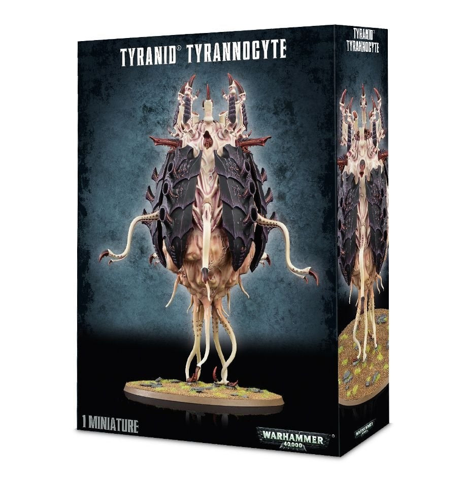 Tyranid Tyrannocyte miniature shown on the front and side of a dark game box, with a pale, fleshy body, dark purple armor plates, raised spines and dangling tentacles on a round base. The box reads “TYRANID TYRANNOCYTE” and “1 MINIATURE.”
