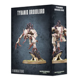 Dark charcoal box for a Tyranid Broodlord miniature, showing the pale, red-accented alien figure with long claws and a purple-black carapace on an oval base. The front and side panels read “TYRANID BROODLORD,” with “1 MINIATURE” and “WARHAMMER 40,000” on the front.