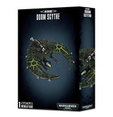 Black Games Workshop box showing a dark gray, crescent-shaped Necron spacecraft miniature with bright green geometric markings and silver details. The box reads “NECRONS” and “DOOM SCYTHE,” with a second partial view of the craft on its side.