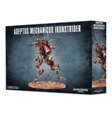 Box for the Adeptus Mechanicus Ironstrider miniature, shown from the front and right side. The artwork depicts a red-and-metallic, long-legged mechanical warrior with a mounted gun on an oval base; the box reads “ADEPTUS MECHANICUS IRONSTRIDER” and “WARHAMMER 40,000.”