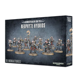 Dark blue-gray box for Genestealer Cults: Neophyte Hybrids, shown from the front and right side. The front depicts a lineup of armed, armored sci-fi miniatures and reads “GENESTEALER CULTS,” “NEOPHYTE HYBRIDS” and “10 MINIATURES,” with the Warhammer 40,000 logo near the bottom.