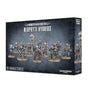 Dark blue-gray box for Genestealer Cults: Neophyte Hybrids, shown from the front and right side. The front depicts a lineup of armed, armored sci-fi miniatures and reads “GENESTEALER CULTS,” “NEOPHYTE HYBRIDS” and “10 MINIATURES,” with the Warhammer 40,000 logo near the bottom.