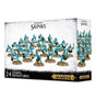 White and black game box showing a group of turquoise Seraphon Skink miniatures with weapons and round bases across the front and side panels. The box reads “SERAPHON SKINKS” and “24 CITADEL MINIATURES,” with Warhammer Age of Sigmar logos.