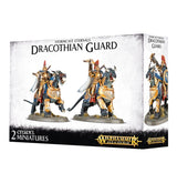 Box for Stormcast Eternals: Dracothian Guard, showing two gold-armored riders with blue and white details on dark, horned draconic mounts; the narrow side repeats one figure. Text reads “DRACOTHIAN GUARD” and “2 CITADEL MINIATURES.”