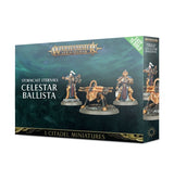 Angled view of a dark teal and gold Celestar Ballista miniature kit box, showing a gold artillery weapon between two armored figures on round bases. The front reads “WARHAMMER AGE OF SIGMAR” and “CELESTAR BALLISTA”; the narrow side repeats the miniature artwork.