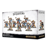 Box of Stormcast Eternals: Sequitors miniatures, with gold-armored warriors in blue, white and red robes wielding weapons pictured across the front and one figure on the side. The box reads “STORMCAST ETERNALS SEQUITORS” and “10 CITADEL MINIATURES.”