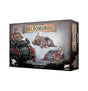 Necromunda: Goliath Maulers miniature box, shown from the front and right side. The gray, rust-toned artwork features muscular riders on red-and-black armored, oversized-wheeled vehicles; the front reads “NECROMUNDA” and “GOLIATH MAULERS.”