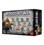 Box for the Blood Bowl Dwarf Giants team, with painted dwarf football miniatures in blue, teal, gold and orange on the front, beside large dwarf character artwork. The box side repeats “BLOOD BOWL” and “THE DWARF GIANTS”; front text includes “×12 MINIATURES”.