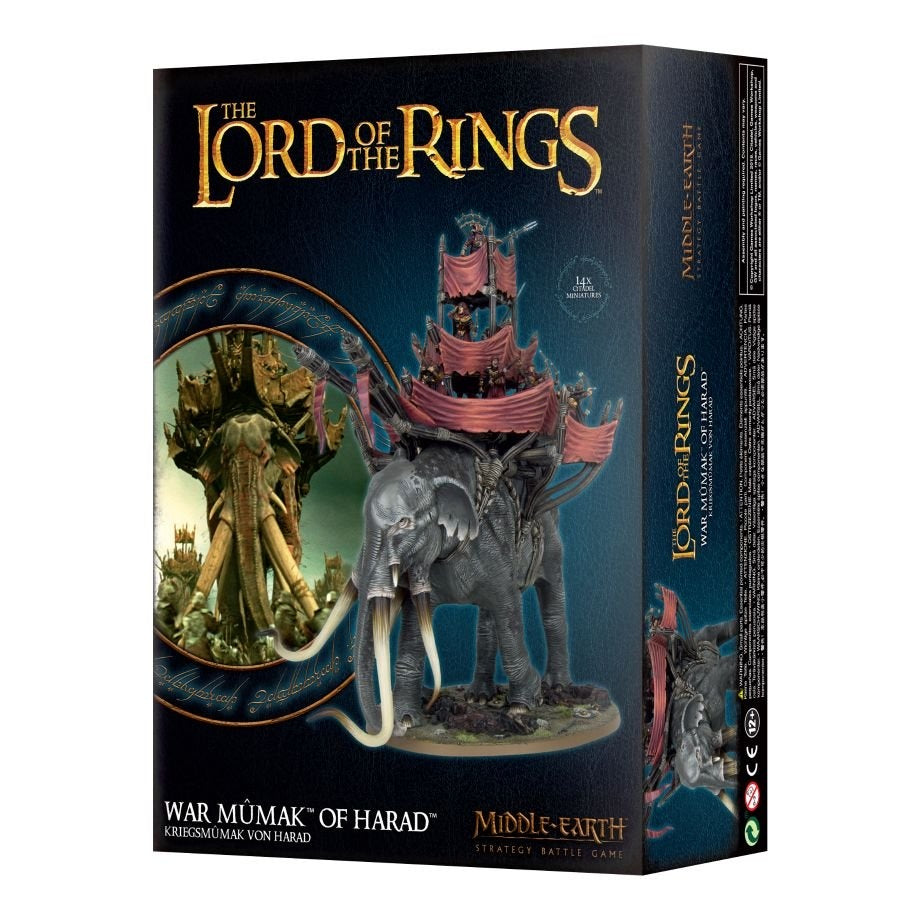 Box for a Middle-Earth miniature set, shown at an angle with its front and right side visible. The front depicts a gray, long-tusked war beast carrying a tiered platform with pink drapes; text reads “THE LORD OF THE RINGS,” “WAR MÛMAK OF HARAD” and “MIDDLE-EARTH.”