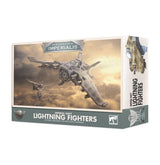 Box for Imperial Navy Lightning Fighters miniatures, with gray aircraft flying through cloudy skies on the front and an aircraft illustration with vertical lettering on the right side. The front reads “AERONAUTICA IMPERIALIS” and “IMPERIAL NAVY LIGHTNING FIGHTERS.”