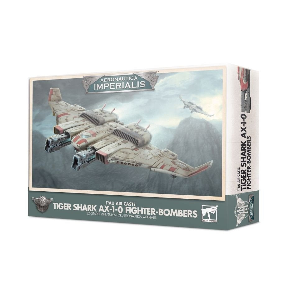 A boxed Aeronautica Imperialis miniature set, shown from the front and right side. The box artwork features a pale gray aircraft with red markings flying over a cloudy landscape; the front reads “AERONAUTICA IMPERIALIS” and “TIGER SHARK AX-1-0 FIGHTER-BOMBERS.”