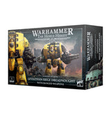 Boxed miniature set shown at an angle, with front artwork of a large yellow armored Leviathan Dreadnought carrying ranged weapons on a smoky battlefield; the right side shows a teal machine. Text reads “WARHAMMER THE HORUS HERESY” and “LEVIATHAN SIEGE DREADNOUGHT WITH RANGED WEAPONS.”