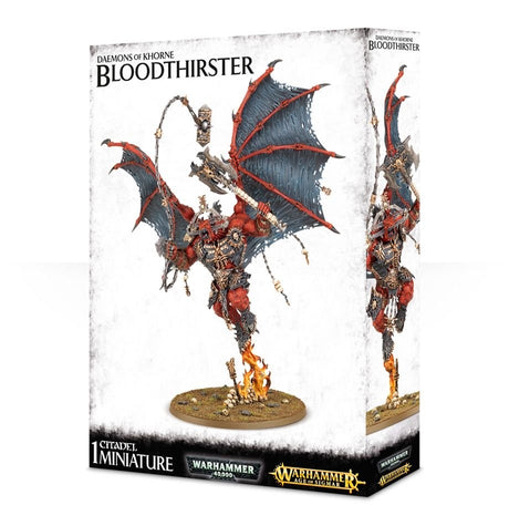 Box for a Bloodthirster miniature, showing a red, armored winged demon hovering above flames on a rocky base; the front and side display different views of the figure. Text reads “DAEMONS OF KHORNE BLOODTHIRSTER” and “1 CITADEL MINIATURE.”