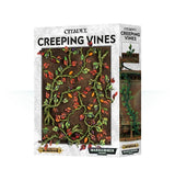 Box of Citadel Creeping Vines, with green winding stems and red, orange, and yellow leaves shown against dark ground on the front; the side shows vines climbing a weathered structure. The box reads “CITADEL” and “CREEPING VINES.”