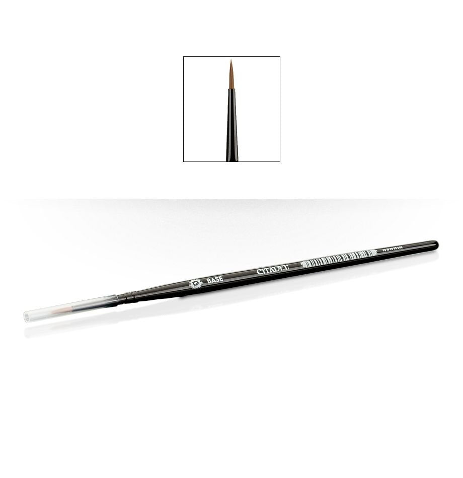 A slim black Citadel base brush lies diagonally on a white background, with a clear protective cap over the bristles and “BASE” and “CITADEL” printed on the handle. An inset above shows its pointed brown bristle tip and dark ferrule close up.