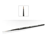 A slim black Citadel base brush lies diagonally on a white background, with a clear protective cap over the bristles and “BASE” and “CITADEL” printed on the handle. An inset above shows its pointed brown bristle tip and dark ferrule close up.