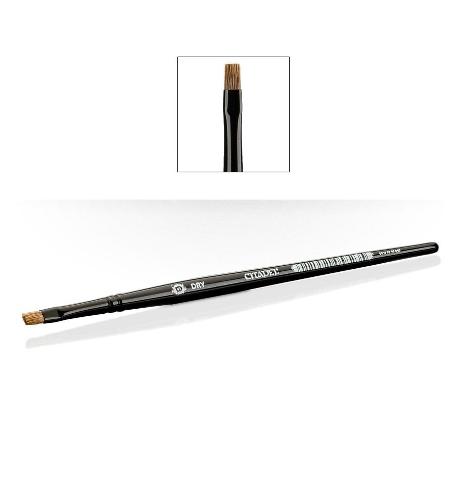 A long, slim black Citadel dry brush lies diagonally on a white background, with short, squared brown bristles at one end. An inset shows the bristle tip close up; the handle is marked “CITADEL” and “DRY”.