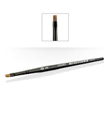 A long, slim black Citadel dry brush lies diagonally on a white background, with short, squared brown bristles at one end. An inset shows the bristle tip close up; the handle is marked “CITADEL” and “DRY”.