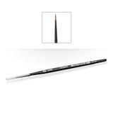 A slim black Citadel layer brush lies diagonally on a white background, with a clear cap over the handle end and a fine pointed brown bristle tip. A small inset shows the tip close up; “CITADEL” and “LAYER” are printed on the handle.