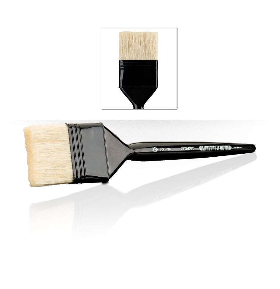 A large scenery brush lies horizontally, with broad cream-colored bristles, a glossy black ferrule and a long tapered black handle marked “SCENERY” and “CITADEL.” An inset above shows a close-up of the bristles and ferrule.