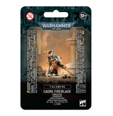 Front of a black and teal Warhammer miniature package showing an orange-armored sci-fi figure holding a long weapon and raising another. The package reads “WARHAMMER 40,000,” “T’AU EMPIRE” and “CADRE FIREBLADE,” with a 12+ age mark.