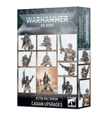 Warhammer 40,000 Astra Militarum: Cadian Upgrades box shown from the front and right side. The dark green and black packaging displays painted sci-fi soldiers in green armor and tan clothing, carrying weapons; text reads “WARHAMMER 40,000” and “ASTRA MILITARUM CADIAN UPGRADES.”