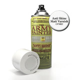 A green-labeled Army Painter anti-shine matt varnish spray can stands beside its white cap, which lies on its side. The label reads “THE ARMY PAINTER” and “ANTI SHINE”; a round callout says “Anti Shine Matt Varnish CP3003.”