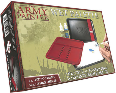 Box for a wet palette showing an open red tray with raised channels beside a black case, white sheet, paint bottles and a hand painting. The front reads “THE ARMY PAINTER” and “WET PALETTE.”